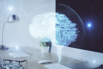 Double exposure of work space with computer and human brain drawing hologram. Brainstorm concept.