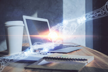 Double exposure of desktop computer and technology theme hologram. Concept of software development.