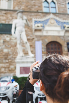 Young Woman Photographing Famous David Statue in Florence, Italy