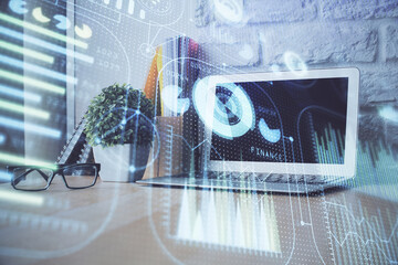 Double exposure of desktop computer and technology theme hologram. Concept of software development.