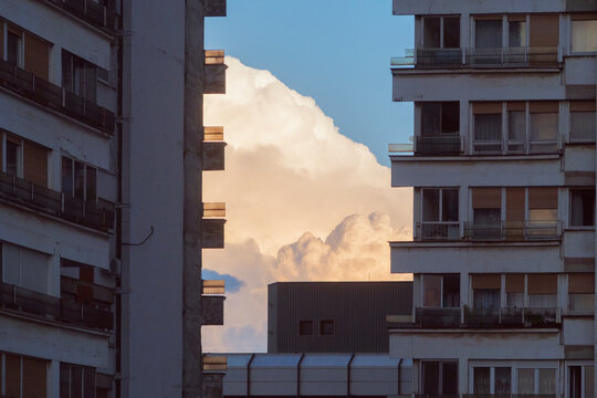 cloud hiding behind the buildings