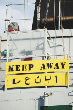 Keep away sign in english and arabian