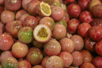 Lots of passion fruit at bazaar. agriculture farm full of organic vegetables. Pile of passion fruit in the store. (selective focus)