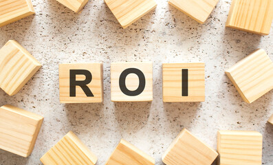 The word consists of wooden cubes with letters, top view on a light background.