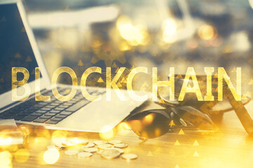 Double exposure of blockchain theme hologram and table with computer background. Concept of bitcoin...