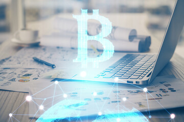 Double exposure of blockchain theme hologram and table with computer background. Concept of bitcoin...