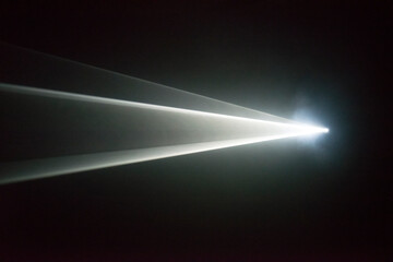 Illuminated beam of light from a projector
