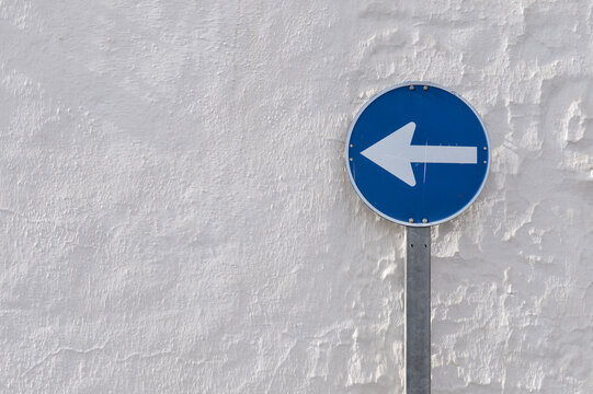 Directional Sign on a white old wall