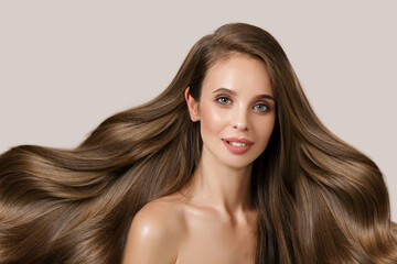 Fototapeta premium brunette with long wavy thick hair. Hair care and coloring concept