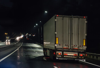 Truck moves on highway at night