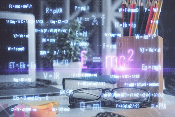 Formulas drawing with glasses on the table background. Concept of science. Double exposure.