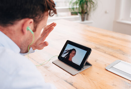 Man talking to his girlfriend on vacation over video chat