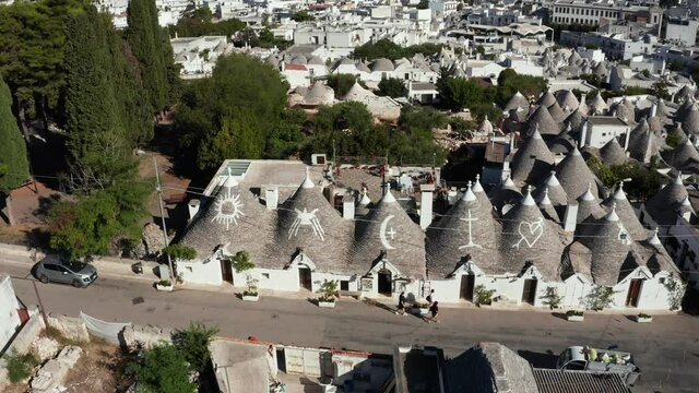 Epic aerial view of the traditional trulli houses in Alberobello, province Bari, region Puglia, Italy. Beautiful white houses Greece style.