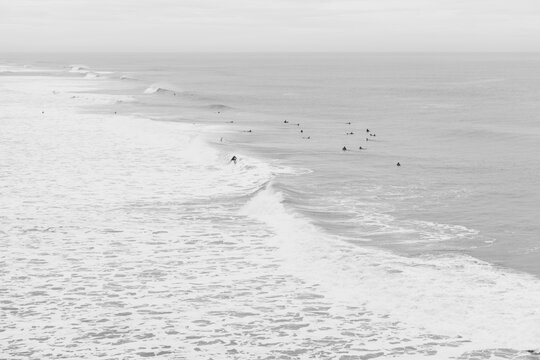 Ocean Beach surfers in black and white.