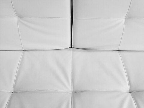 Detail of modern & minimalist white leather chair