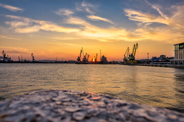 Naklejka premium sunset over the harbor in Burgas city