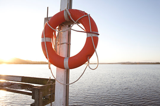 The pier at Marlo, Australia with life buoy at sunset