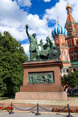 Fototapeta na wymiar Monument to Minin and Pozharsky by St Basil`s Cathedral in Moscow, Russia