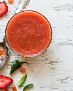 Strawberry gazpacho soup in bowl with peppers