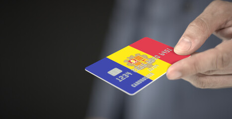 Credit bank card with printed flag of Andorra. Fictional numbers
