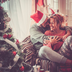 Concept of real happy life together with caucasian people at home in christmas eve day celebration...