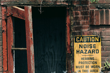 Entrance with yellow caution hazard warning sign on wall
