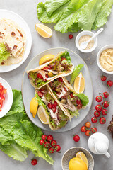 Tacos with chicken meat, salad and vegetables