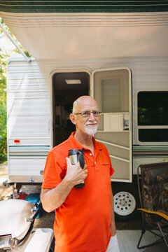 Older gentleman standing outside RV outside