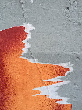 Close up of peeling posters on wall