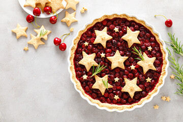Homemade cherry pie, tart with star shaped cookies
