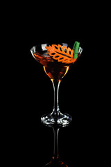 Cocktail Rob Roy .  Art in orange- fruits carving.