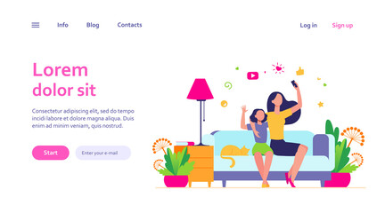 Mom and daughter leisure concept. Teen girl and her mother sitting on couch at home, using smartphone for video call or taking selfie. Can be used for family, mobile technology topics