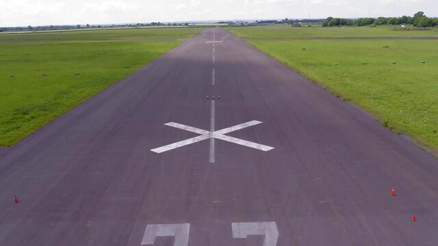Parallax Rise to reveal number 27 and letter X on a Runway with a slow twist towards the end.
