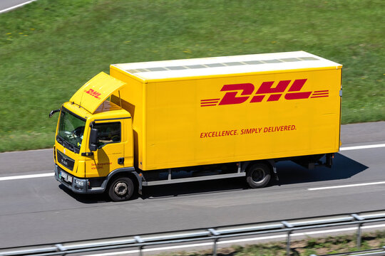 ENGELSKIRCHEN, GERMANY - JUNE 24, 2020: DHL MAN TGL truck on motorway. DHL is a division of the German logistics company Deutsche Post AG providing international express mail services.