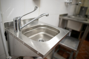 Clean faucet with sink in a public place
