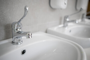 Clean faucet with sink in a public place