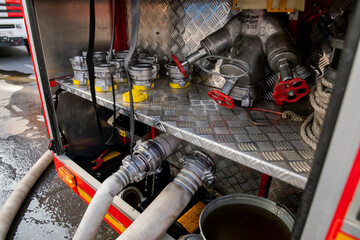 Fire hoses at a fire engine, high water pressure