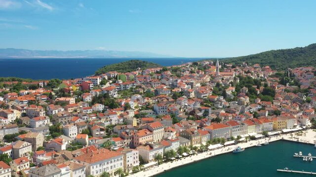 Marina and seafront in town of Mali Losinj on the island of Losinj, Adriatic coast in Croatia, touristic destination, drone aerial footage