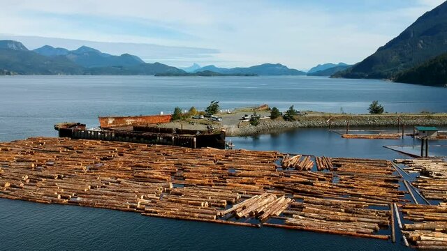 Log booms with mountains in background