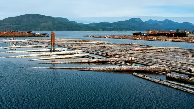 Log booms with mountains in background