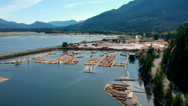 Log booms with mountains in background