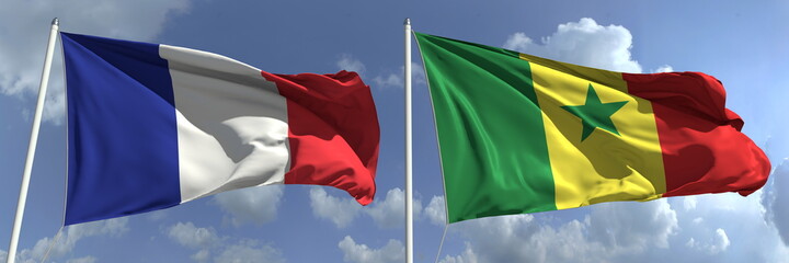 Flags of France and Senegal on flagpoles. 3d rendering