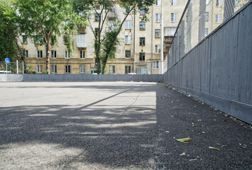 Obraz premium Asphalt pavement of the children's yard sports ground for playing Canadian hockey.