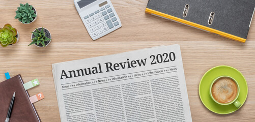 A newspaper on a desk with the headline Annual review 2020