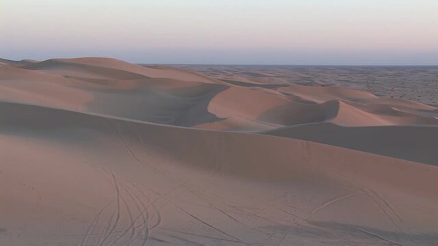 Pan shot of North Algodones Dunes in California in evening sun.