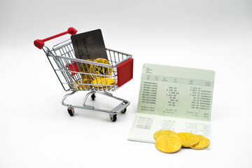 A shopping cart with bitcoin,credit card and bankbook. The concept of shopping on the...