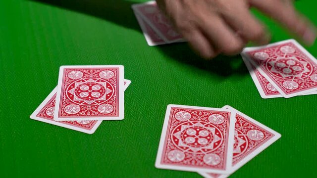 Dealing a deck of playing cards into 4 piles in a clockwise direction on a poker table in 4K