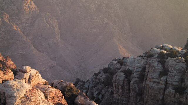 Dana valley, rocky valley with sunset . Dana nature reserve, Jordan. pan left. 4K