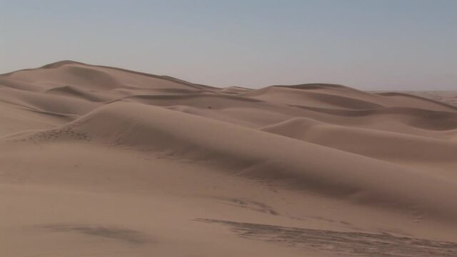 Pan shot of North Algodones Dunes in California in the midday heat, USA.