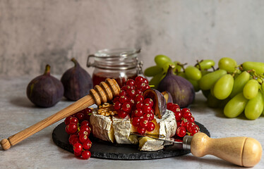 Oven baked Camembert with berries, honey, and figs.